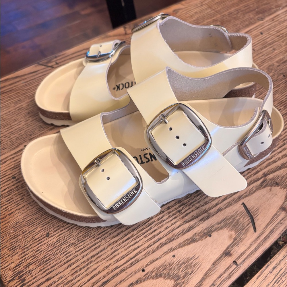 Birkenstock Cream Sandals with Silver Buckles